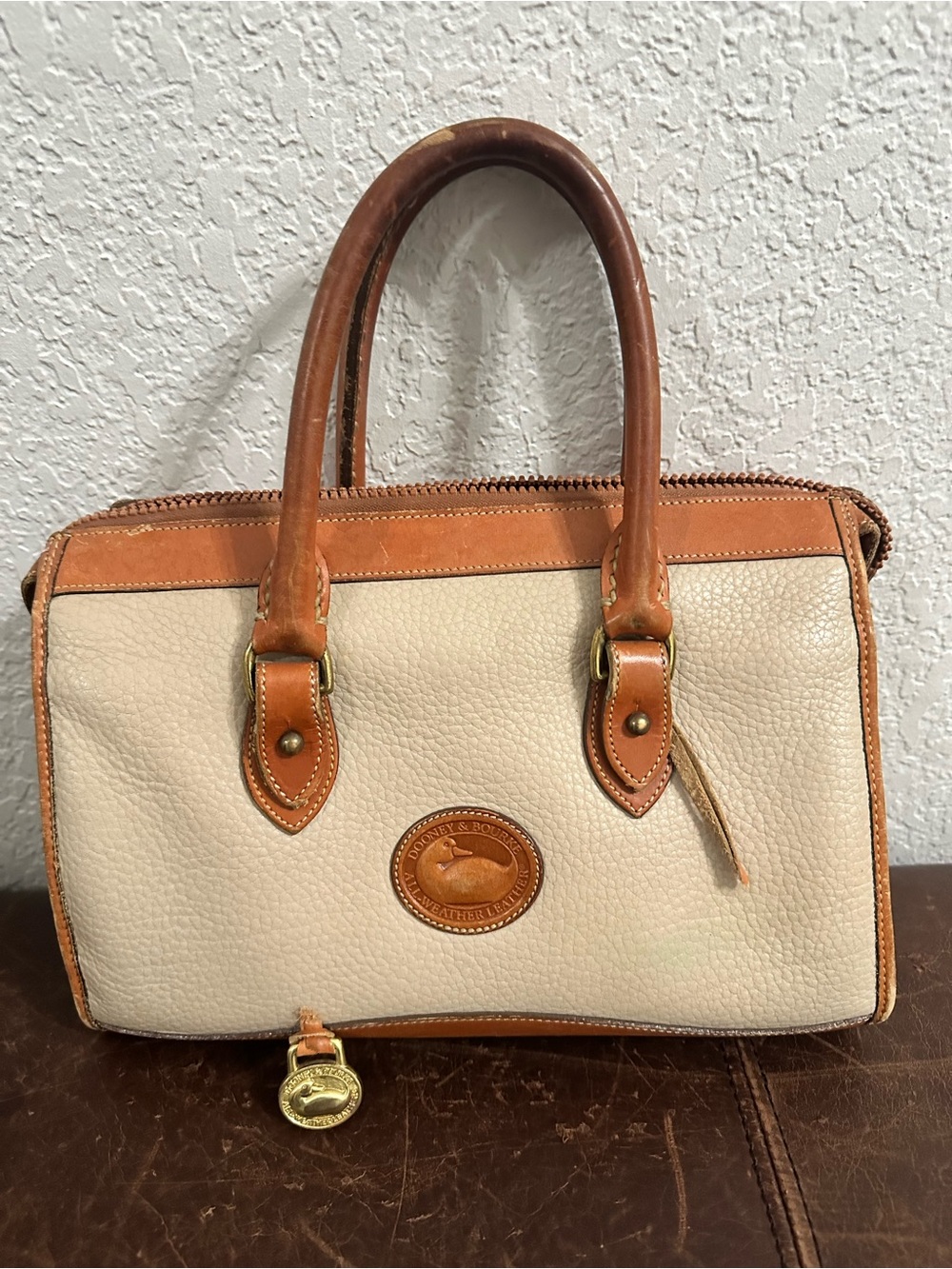 Dooney & Bourke Cream Pebbled Leather Satchel with Tan Trim